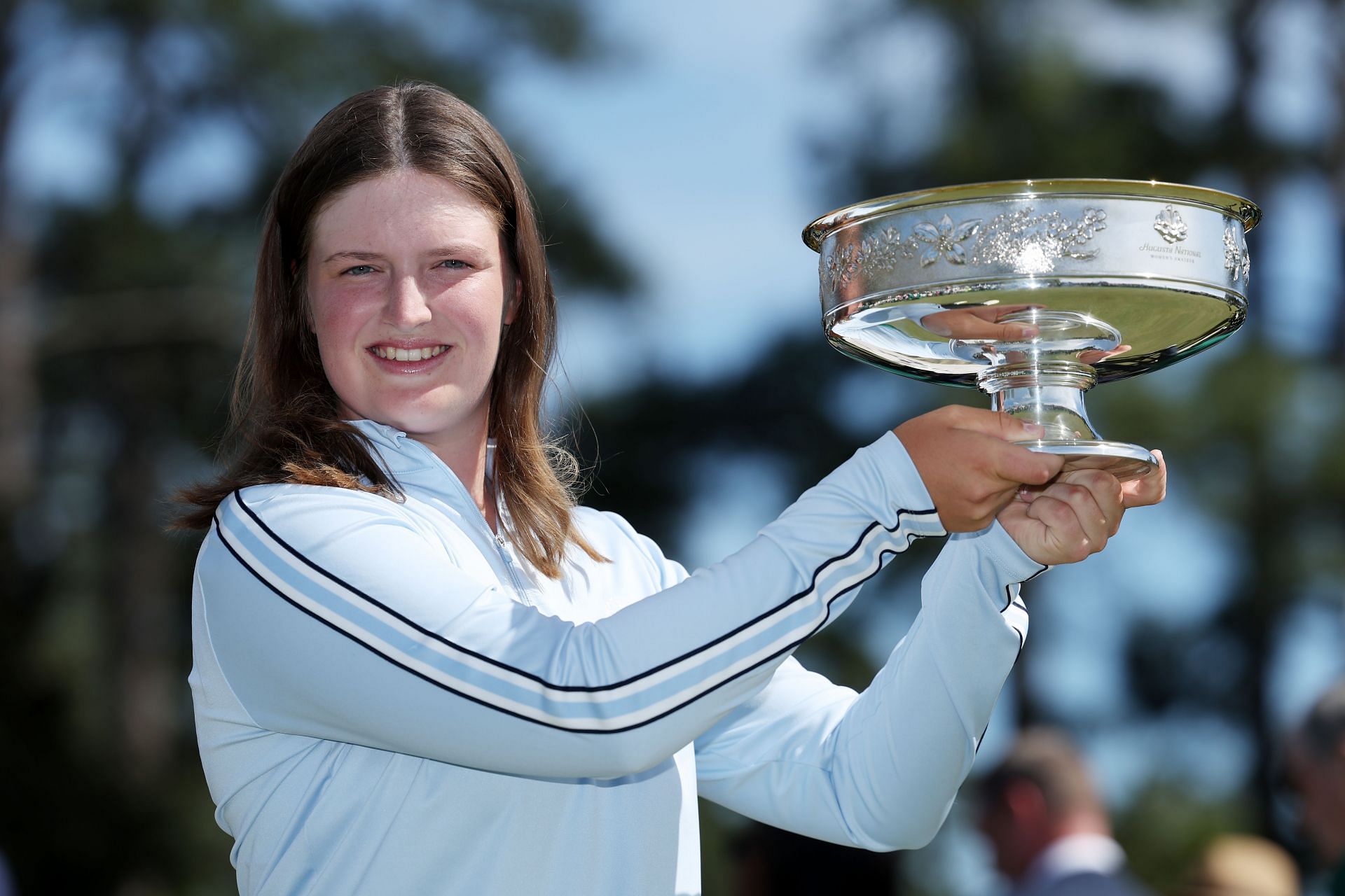 Lottie Woad with the trophy after her win at the Augusta National Women's Amateur in 2024 - Source: Getty
